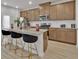 Well-equipped kitchen with an island, stainless steel appliances, and wood cabinets offering ample storage at 2766 Aralynn Way, College Park, GA 30337