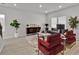 Bright and modern living room featuring elegant furniture, a stylish rug, and a view of the entryway at 2766 Aralynn Way, College Park, GA 30337