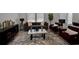Cozy living room with plush seating, a marble coffee table, and a large window for natural light at 2766 Aralynn Way, College Park, GA 30337