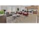 Open-concept living room with an eat-in kitchen, stylish decor, and plenty of natural light at 2766 Aralynn Way, College Park, GA 30337