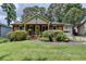 Charming red brick home featuring a lush front yard and well-manicured landscaping at 3232 Valaire Drive Dr, Decatur, GA 30033