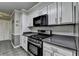 Modern kitchen boasts stainless steel appliances and sleek cabinetry at 3232 Valaire Drive Dr, Decatur, GA 30033