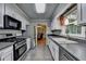 Well-lit kitchen featuring stainless steel appliances and ample counter space at 3232 Valaire Drive Dr, Decatur, GA 30033