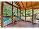 Inviting screened porch with wooden ceiling, comfortable seating, and views of the lush backyard at 3232 Valaire Drive Dr, Decatur, GA 30033
