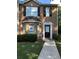Traditional brick home featuring well-maintained landscaping and a welcoming entrance at 8430 Carlington Ln, Jonesboro, GA 30236