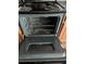 Close-up of oven interior with metal racks, showcasing the cleanliness and functionality at 8430 Carlington Ln, Jonesboro, GA 30236