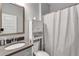 Bathroom featuring a vanity, toilet, cabinet, and shower with a curtain, offering a functional and well-organized space at 109 Jodi Pl, Locust Grove, GA 30248