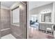 Bathroom view showing the shower and leading to a large living space at 109 Jodi Pl, Locust Grove, GA 30248