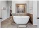 Modern bathroom with a freestanding tub, tiled shower, and neutral color palette creating a spa-like retreat at 109 Jodi Pl, Locust Grove, GA 30248