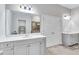 Spacious bathroom with double sinks, a large mirror, and modern lighting, ideal for everyday convenience at 109 Jodi Pl, Locust Grove, GA 30248