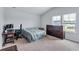 Bedroom featuring a bed, desk, and dresser, providing a practical and comfortable living space at 109 Jodi Pl, Locust Grove, GA 30248