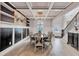 Elegant dining room featuring coffered ceilings, modern chandelier, and hardwood floors at 109 Jodi Pl, Locust Grove, GA 30248