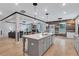 Spacious kitchen featuring a large island with seating and open floor plan to living room at 109 Jodi Pl, Locust Grove, GA 30248