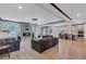 Open-concept living space with wood floors, ample natural light, a fireplace, and easy access to the kitchen and dining areas at 109 Jodi Pl, Locust Grove, GA 30248