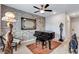 Elegant room with a grand piano and decorative stone wall, great as a music room at 109 Jodi Pl, Locust Grove, GA 30248