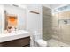 Bright bathroom with stylish tile shower, sleek vanity, modern fixtures, and open access to the bedroom at 167 Sampson Ne St, Atlanta, GA 30312