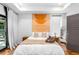Cozy bedroom with hardwood floors, soft lighting, and stylish wall decor at 167 Sampson Ne St, Atlanta, GA 30312