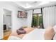Bedroom featuring a TV, soft lighting, and sliding glass doors to the outdoors at 167 Sampson Ne St, Atlanta, GA 30312