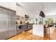 Gourmet kitchen featuring stainless steel Viking appliances, quartz countertops, island seating, and an open floor plan at 167 Sampson Ne St, Atlanta, GA 30312