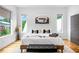 Serene bedroom featuring hardwood floors, a modern bed, ample natural light, and a simple, elegant design at 167 Sampson Ne St, Atlanta, GA 30312