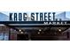 Daytime shot of the entrance to Krog Street Market, showing the sign, brick facade, and overhead lighting at 167 Sampson Ne St, Atlanta, GA 30312