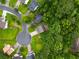 Overhead aerial view showcasing the home's location in a suburban neighborhood near mature trees at 2732 Dahlonega Trl, Austell, GA 30106