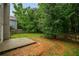 Backyard featuring a grass area and small patio at 2732 Dahlonega Trl, Austell, GA 30106