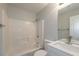 Clean bathroom with white tile, shower, vanity and fixtures at 2732 Dahlonega Trl, Austell, GA 30106