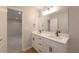 Bathroom with a double sink vanity, modern black fixtures, and a view into the bedroom at 2732 Dahlonega Trl, Austell, GA 30106