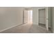 Bedroom featuring neutral walls, grey carpet, and open closet at 2732 Dahlonega Trl, Austell, GA 30106