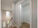 Hallway featuring open closet and staircase with chandelier at 2732 Dahlonega Trl, Austell, GA 30106