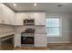 Kitchen featuring stainless appliances, granite countertops, and white cabinets with subway tile backsplash at 2732 Dahlonega Trl, Austell, GA 30106