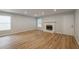 Modern living area featuring hardwood floors, a classic fireplace, and abundant natural light for a cozy atmosphere at 2732 Dahlonega Trl, Austell, GA 30106