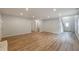 Spacious living room with hardwood floors and open concept feel, perfect for entertaining guests in style at 2732 Dahlonega Trl, Austell, GA 30106