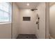 Modern walk-in shower featuring black hardware and a decorative mosaic tiled shower floor at 2732 Dahlonega Trl, Austell, GA 30106