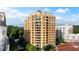 Luxury high-rise condominium building showcasing elegant architecture, multiple balconies, and a tree-lined street at 3286 Northside Nw Pkwy # Ph2, Atlanta, GA 30327
