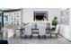 Elegant dining room features designer chairs, a sleek table, modern décor, and a large mirror, and a china cabinet at 3286 Northside Nw Pkwy # Ph2, Atlanta, GA 30327