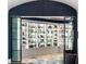 Stunning curved display cabinet filled with art and collectibles, set against a unique mosaic tile floor at 3286 Northside Nw Pkwy # Ph2, Atlanta, GA 30327