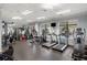 Well-equipped gym featuring treadmills, weight machines, and large windows at 3286 Northside Nw Pkwy # Ph2, Atlanta, GA 30327