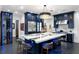 Eat-in kitchen with a waterfall island, stainless steel appliances, and modern chandelier at 3286 Northside Nw Pkwy # Ph2, Atlanta, GA 30327