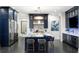 Modern kitchen featuring a large center island with marble countertops and gold accents at 3286 Northside Nw Pkwy # Ph2, Atlanta, GA 30327