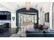 Open-concept living space with a display cabinet, wet bar, and a seamless flow to the kitchen at 3286 Northside Nw Pkwy # Ph2, Atlanta, GA 30327
