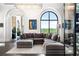 Comfortable living room showcasing a large sectional couch, modern lighting, and outdoor views at 3286 Northside Nw Pkwy # Ph2, Atlanta, GA 30327