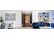 Inviting living room features unique artwork and seamlessly connects to the dining area at 3286 Northside Nw Pkwy # Ph2, Atlanta, GA 30327