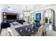 Bright living room featuring a modern fireplace, recessed lighting, a dining table, and scenic backyard views at 3286 Northside Nw Pkwy # Ph2, Atlanta, GA 30327