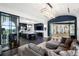 Open floor plan showcases the stylish kitchen, living room, and glass-enclosed wine storage at 3286 Northside Nw Pkwy # Ph2, Atlanta, GA 30327