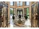 Grand building lobby with detailed tile floor, statement table, and decorative ironwork at 3286 Northside Nw Pkwy # Ph2, Atlanta, GA 30327