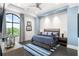 Cozy main bedroom with textured wall, blue accents, large window, and ample natural light at 3286 Northside Nw Pkwy # Ph2, Atlanta, GA 30327