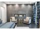 Beautiful bedroom with a modern fireplace, seating area, and large windows at 3286 Northside Nw Pkwy # Ph2, Atlanta, GA 30327