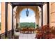 Inviting outdoor patio featuring a dining table, elegant chandelier and beautiful views of the surrounding landscape at 3286 Northside Nw Pkwy # Ph2, Atlanta, GA 30327